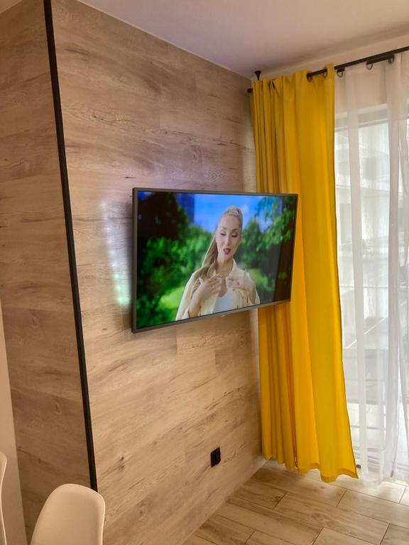 Televízia a/alebo spoločenská miestnosť v ubytovaní BALTICUS Promenada Gwiazd 14A apartament 88