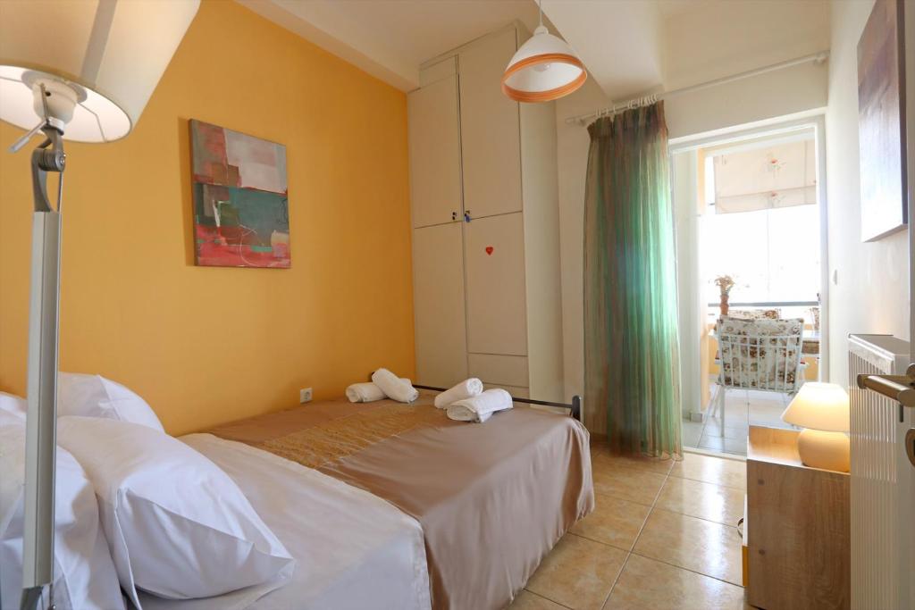 Łóżko lub łóżka w pokoju w obiekcie Port Apartment