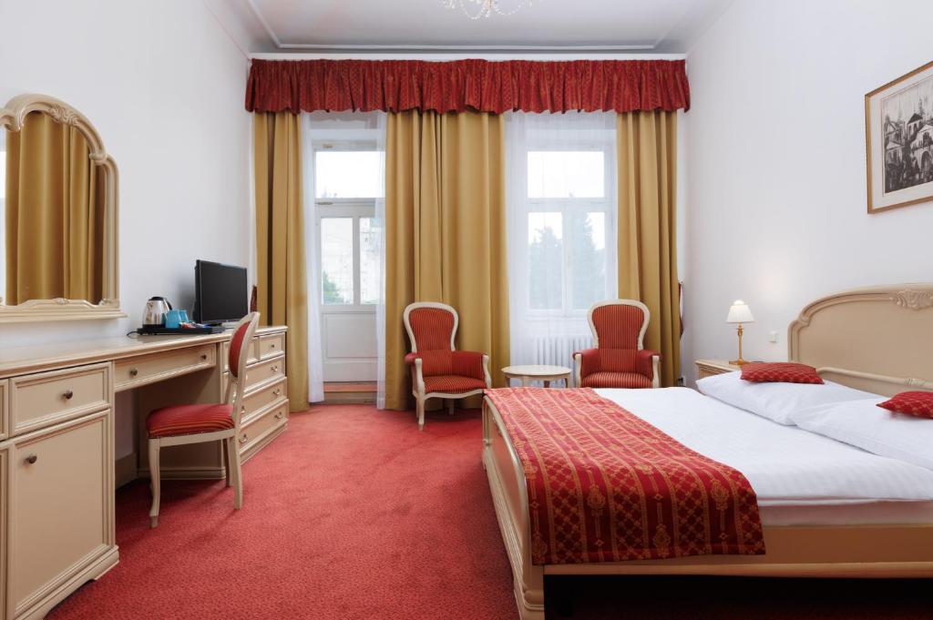 Postel nebo postele na pokoji v ubytování OREA Spa Hotel Palace Zvon Mariánské Lázně