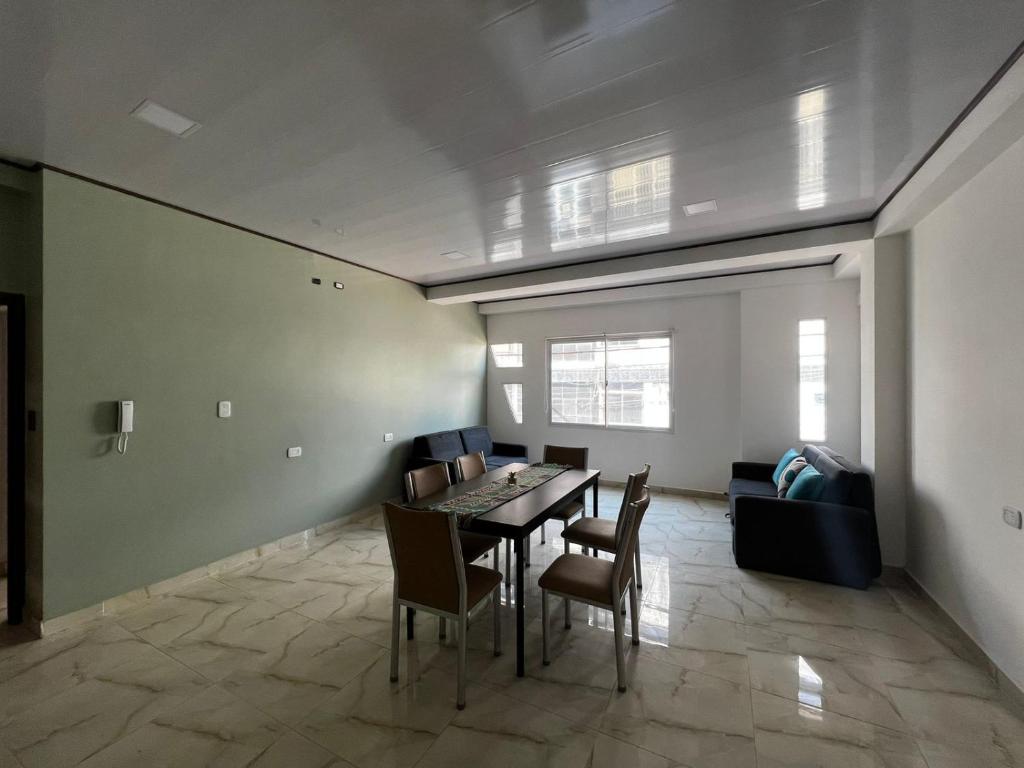 a dining room with a table and chairs at EDIFICIO BETEL in Salvador Mazza