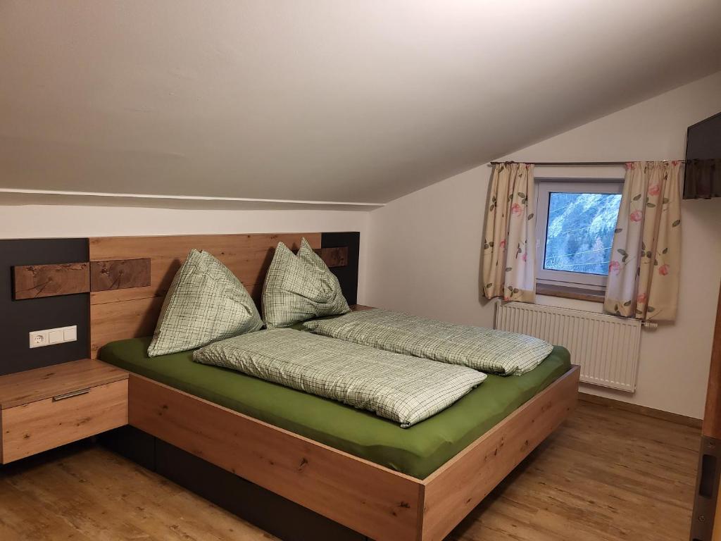 Postel nebo postele na pokoji v ubytování Saumerhof