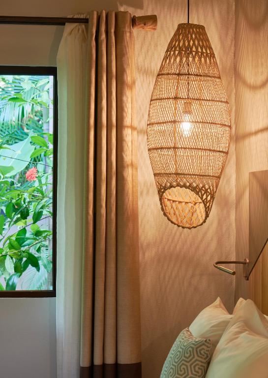 Postel nebo postele na pokoji v ubytování Cala Luna Boutique Hotel & Villas