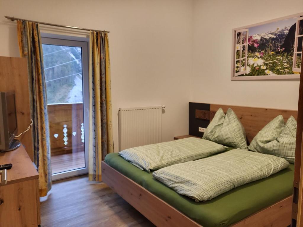 Postel nebo postele na pokoji v ubytování Saumerhof