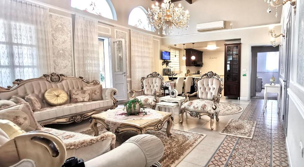 a living room filled with furniture and a chandelier at Mina Akko sea view in Acre