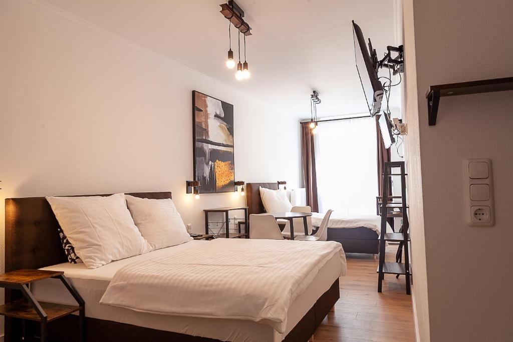 Postel nebo postele na pokoji v ubytování Hotel Soers