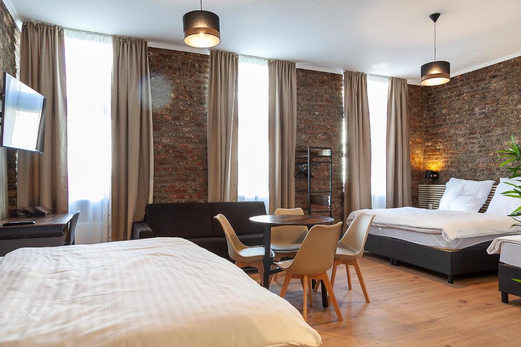 Postel nebo postele na pokoji v ubytování Hotel Soers