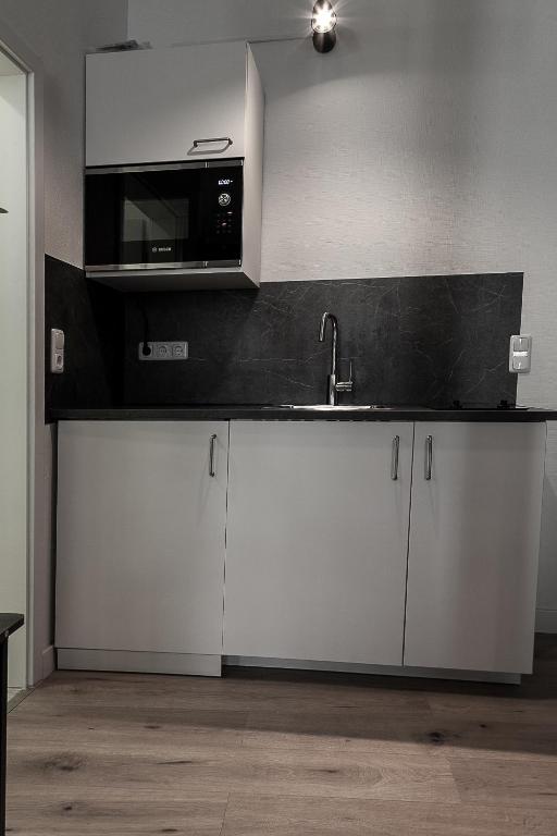 Kuchyň nebo kuchyňský kout v ubytování Hotel Soers