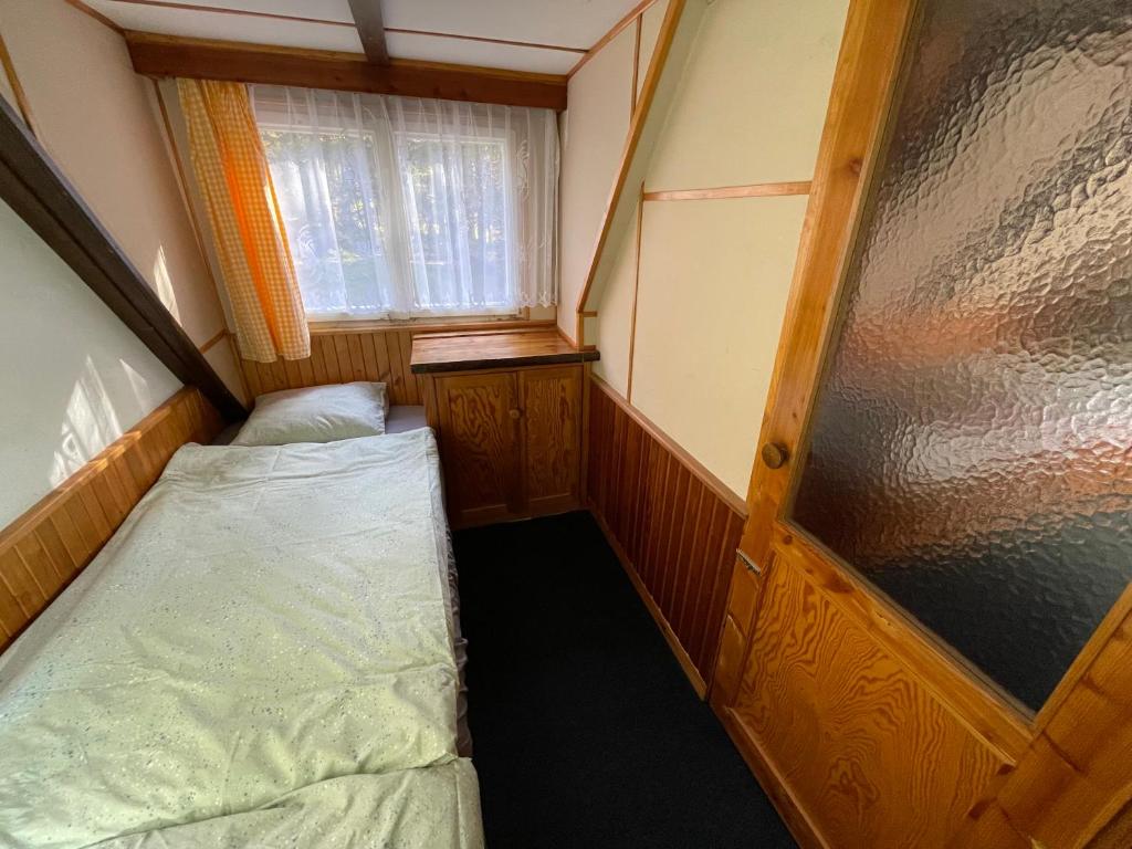 Postel nebo postele na pokoji v ubytování Chata na Cihelně