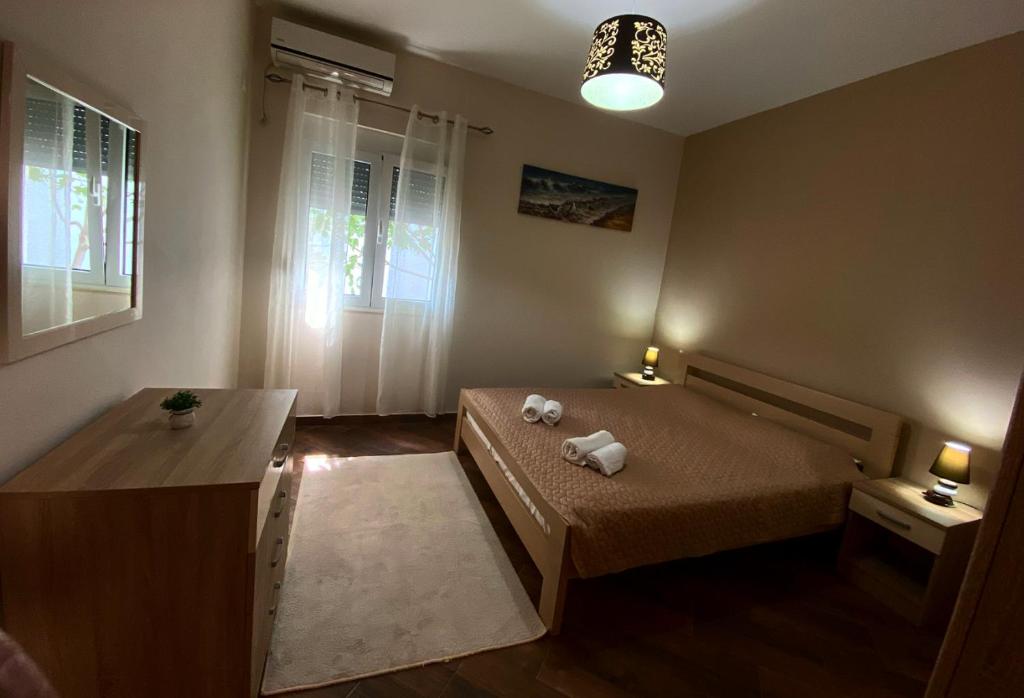 Postel nebo postele na pokoji v ubytování Casa Liburnia