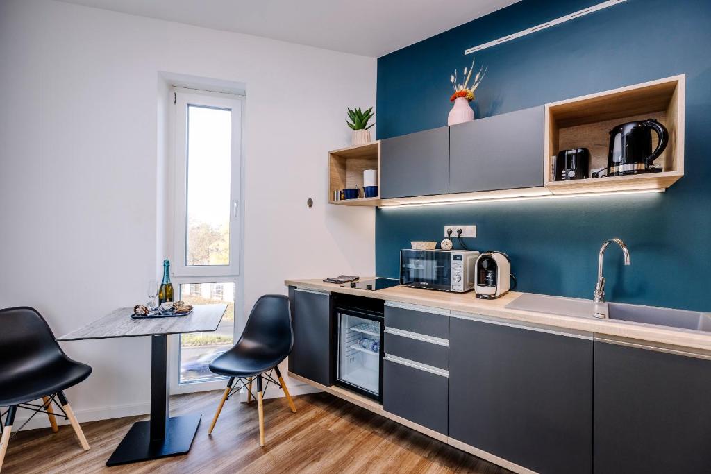 Kuchyňa alebo kuchynka v ubytovaní Amadé Apartmanok 2