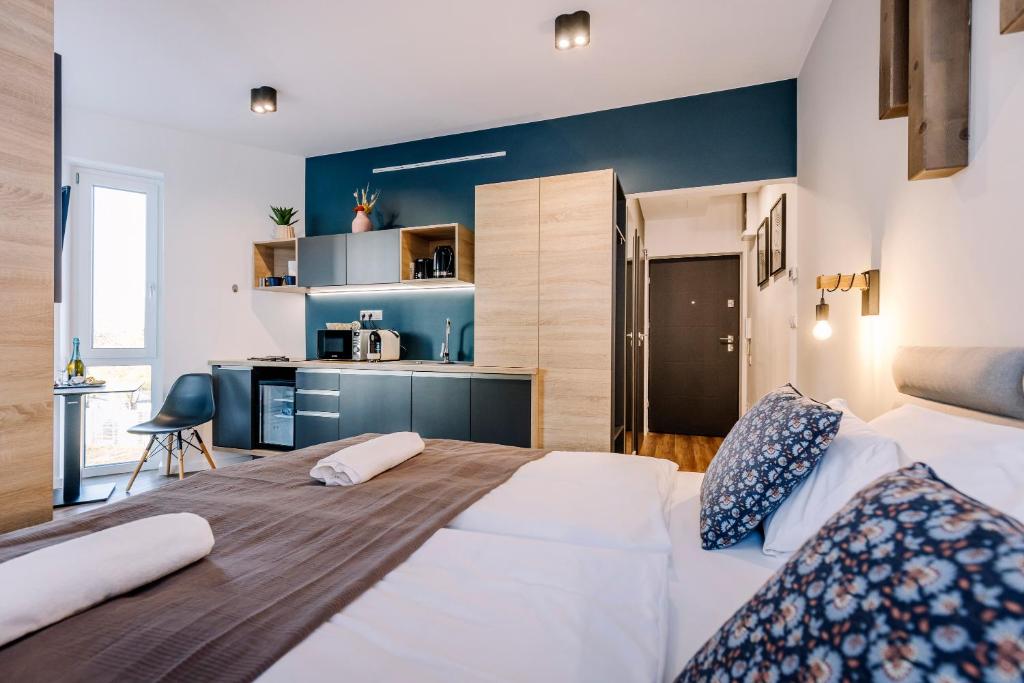 Posteľ alebo postele v izbe v ubytovaní Amadé Apartmanok 2
