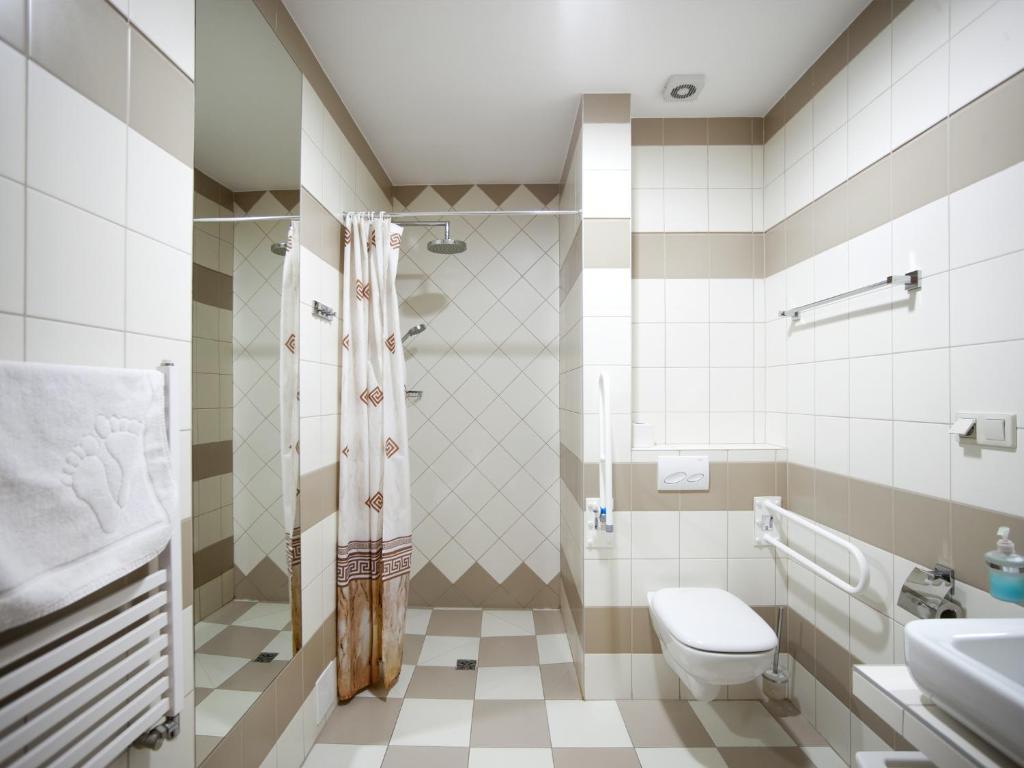 Kúpeľňa v ubytovaní Ośrodek Wczasowy Paradise