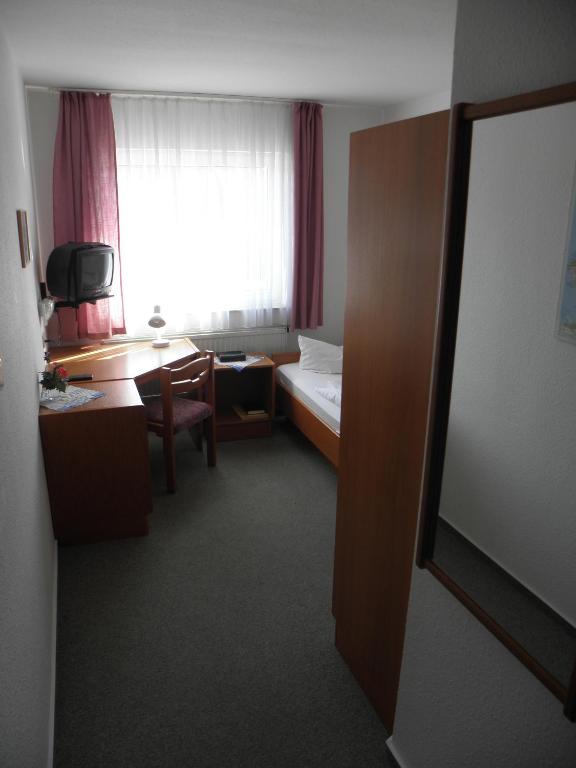 Postel nebo postele na pokoji v ubytování Gasthof Breeger-Bodden