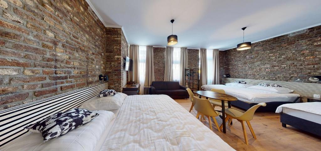 Postel nebo postele na pokoji v ubytování Hotel Soers