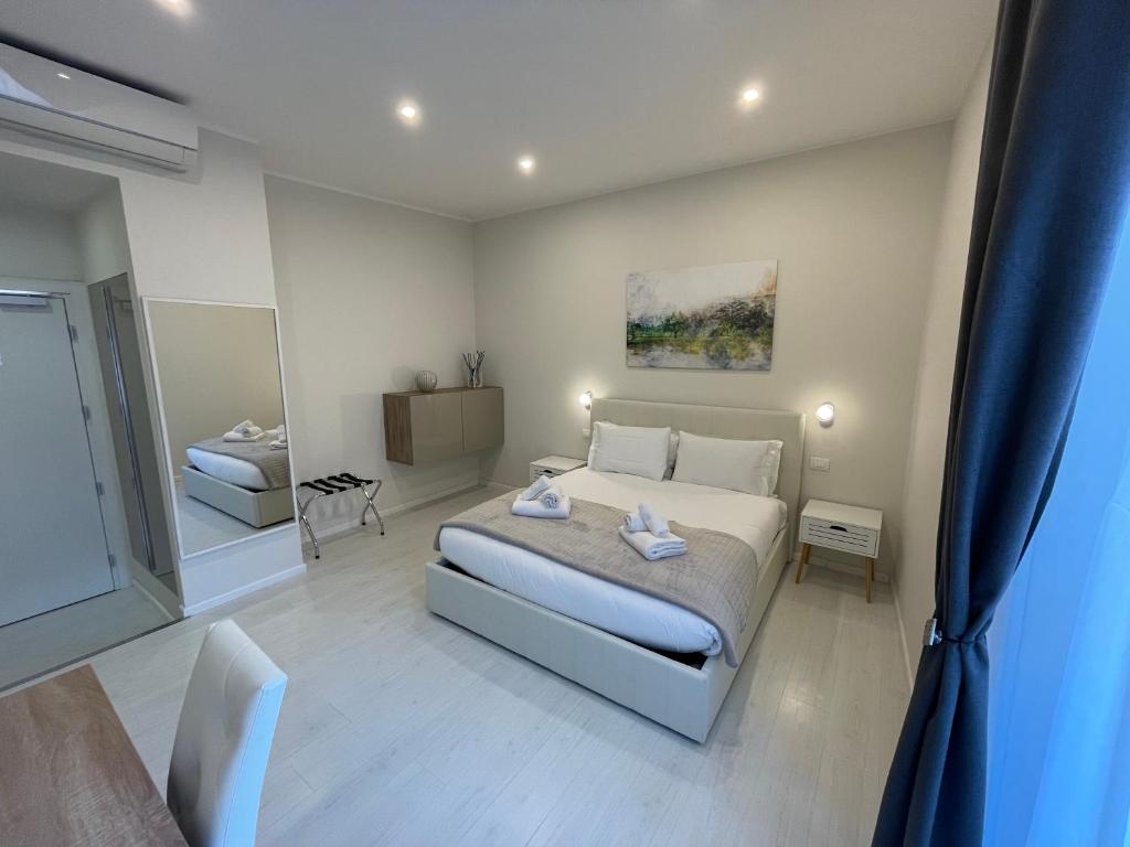 a bedroom with a bed and a large window at Quintus Luxury Suites in Rome