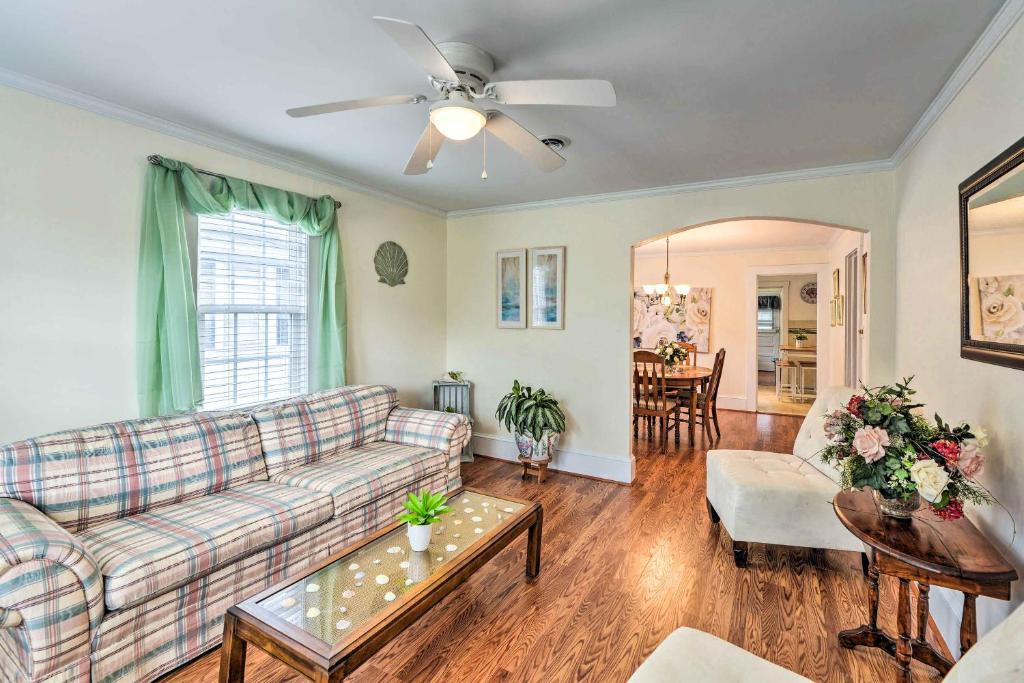 a living room with a couch and a table at Charming Beaufort Getaway Walk to the Waterfront! in Beaufort