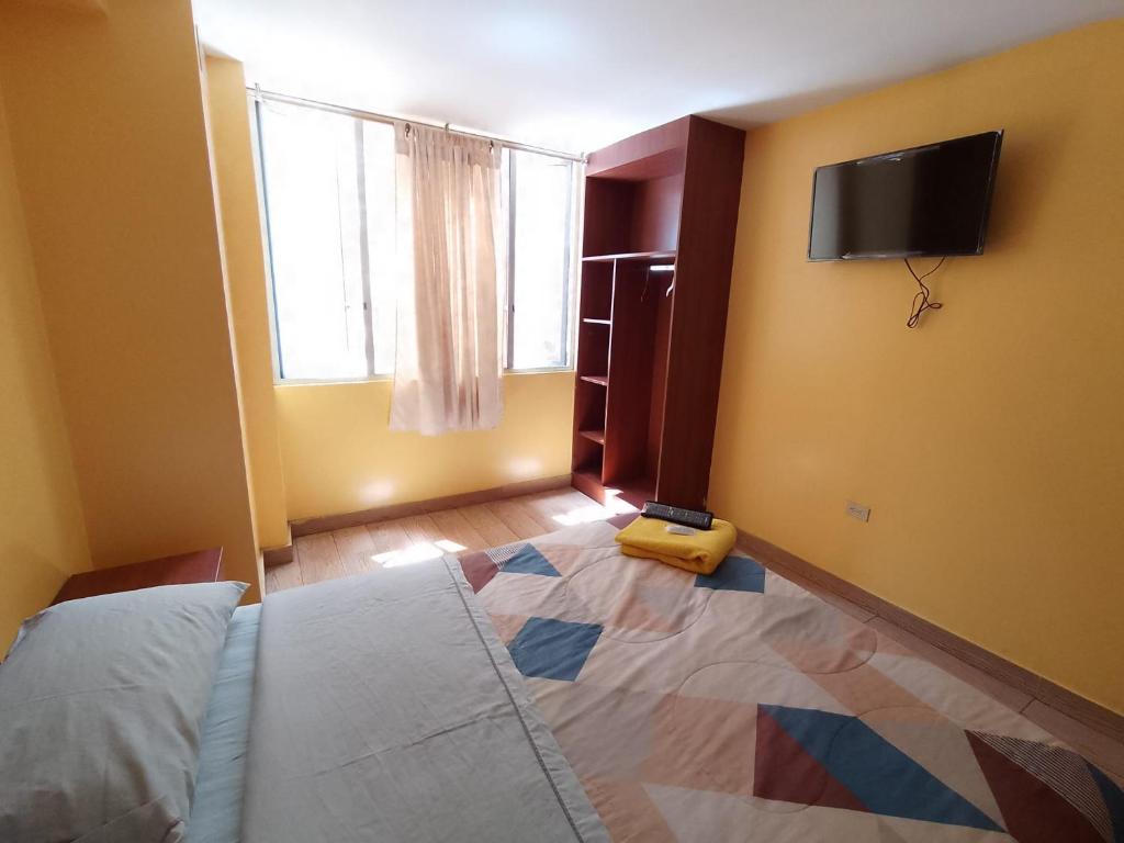 Postel nebo postele na pokoji v ubytování Hotel Residencial Miraflores