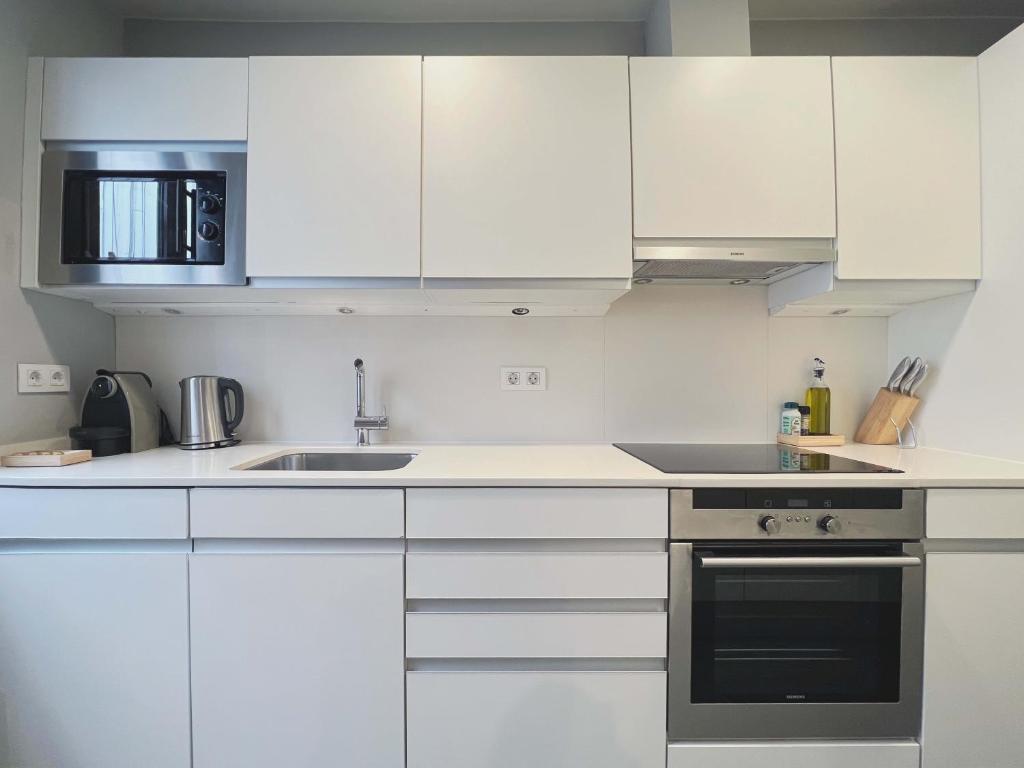 Kuchyň nebo kuchyňský kout v ubytování Stay U-nique Apartments Rambla Catalunya II