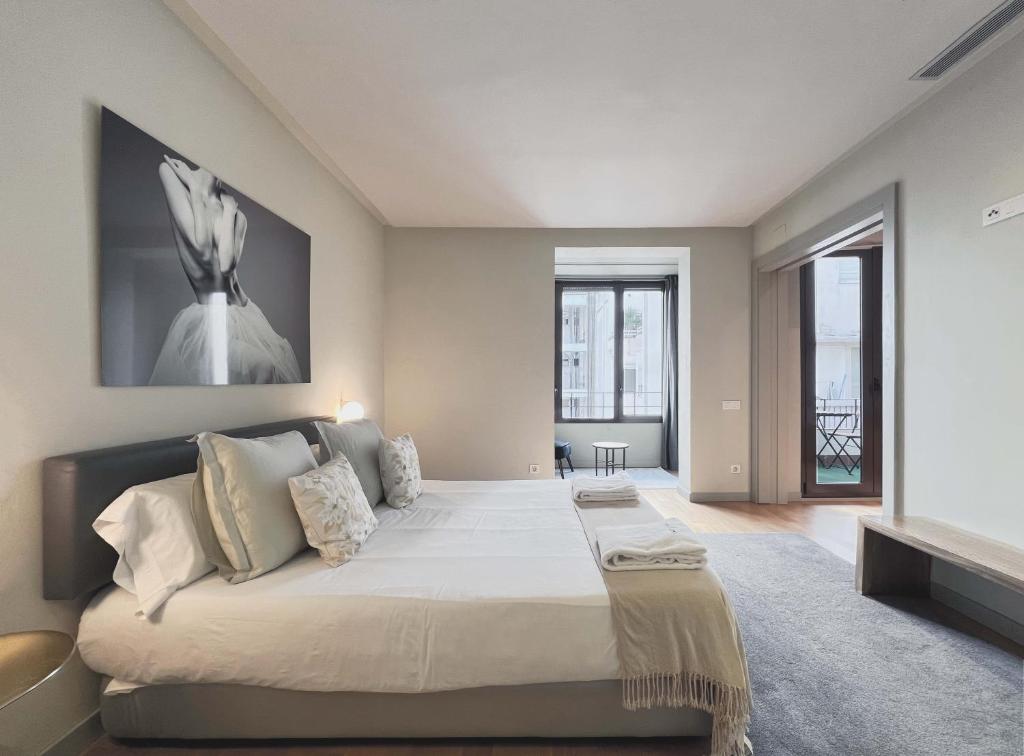 Postel nebo postele na pokoji v ubytování Stay U-nique Apartments Rambla Catalunya II