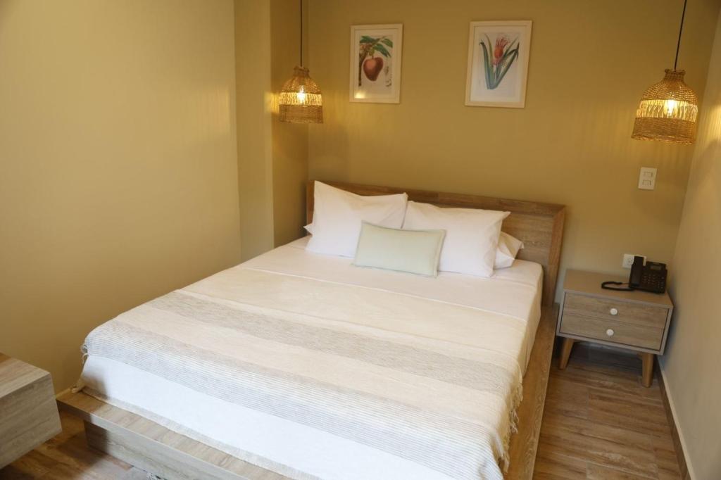 Postel nebo postele na pokoji v ubytování Mythical Hotel Boutique