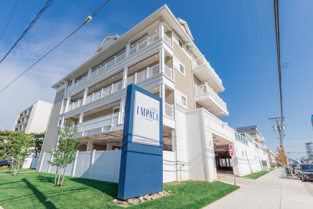 a building with a sign in front of it at Impala Suites in Ocean City