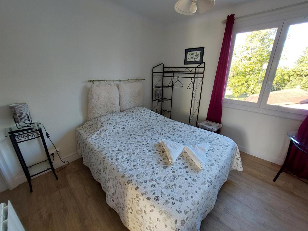 Postel nebo postele na pokoji v ubytování Hotel au Charme du Levat