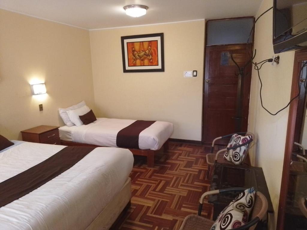 Cama o camas de una habitación en CasaHotel Centro - Huancayo