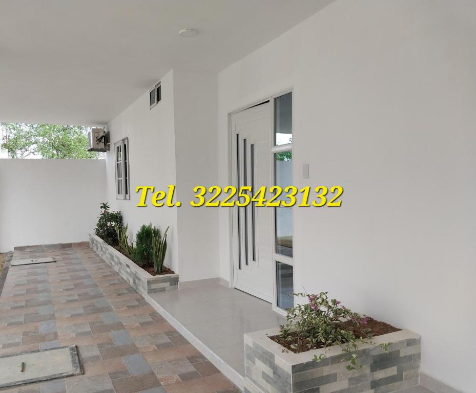 a house for sale with white walls and concrete floors at Cabañas Berakah in Coveñitas