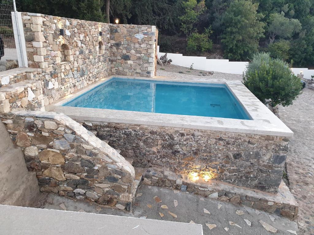 The swimming pool at or close to Chaihoutes stone villa into Olive farm in Zia