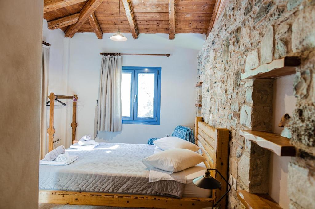 A bed or beds in a room at Chaihoutes stone villa into Olive farm in Zia