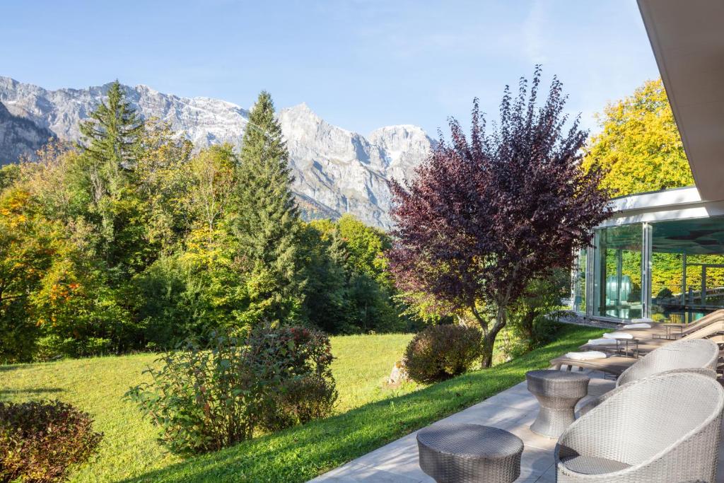 a glass house with a view of the mountains at Hotel Waldegg - Adults only in Engelberg