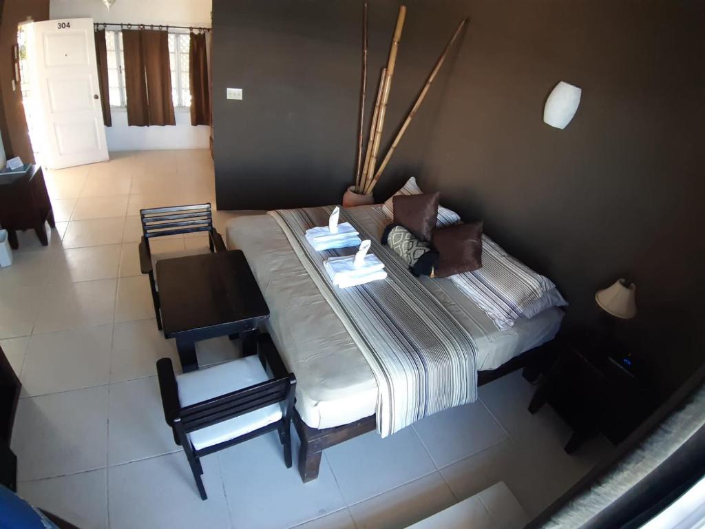 Voodi või voodid majutusasutuse Moxons Beach Club toas