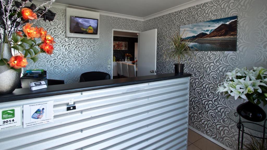 TV a/nebo společenská místnost v ubytování Phoenix Motels