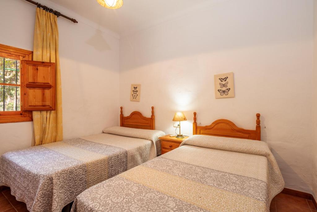 Posteľ alebo postele v izbe v ubytovaní Casa La Encina