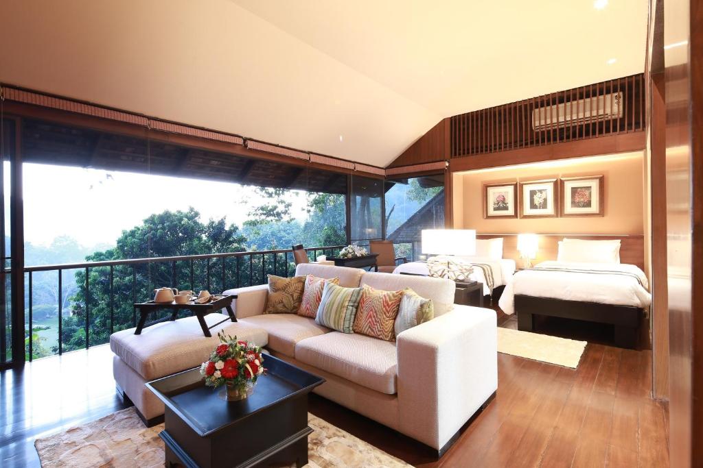 En eller flere senge i et værelse på Vanilla hill (hill lodge)