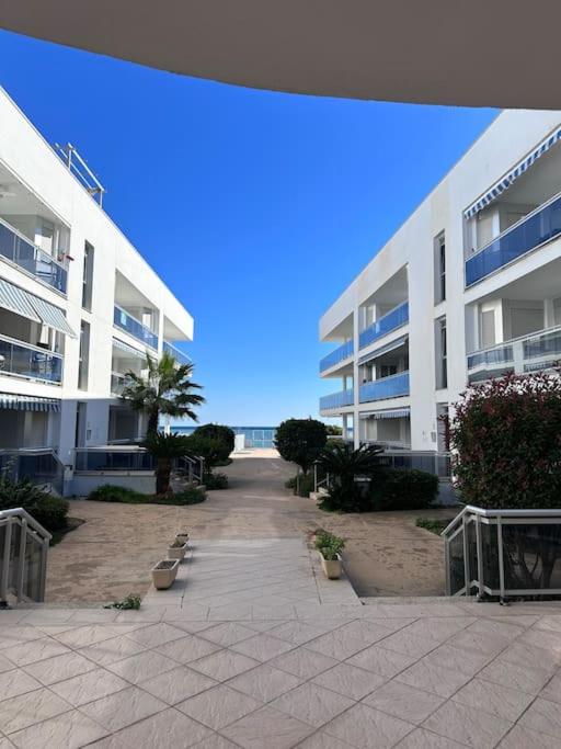 a view of a large apartment building with a courtyard at Riviera Mont Roig Del Camp in Tarragona