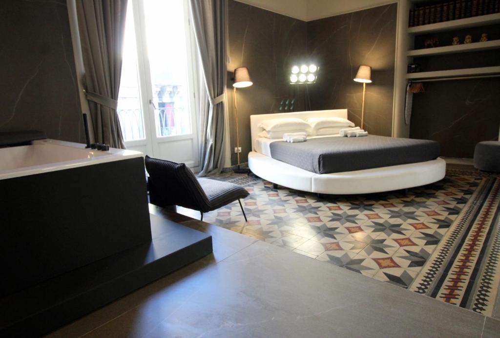 A bed or beds in a room at Duomo Housing Catania Le Suites