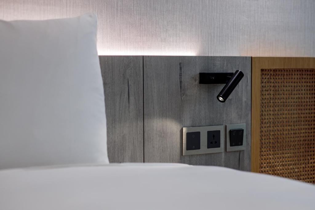 Postel nebo postele na pokoji v ubytování Dahu Park Hotel