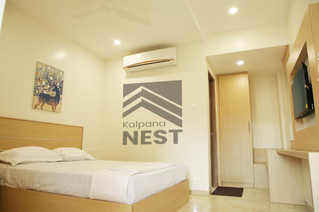 TudiyalūrにあるKALPANA NESTのベッドルーム1室(ベッド1台付)が備わります。