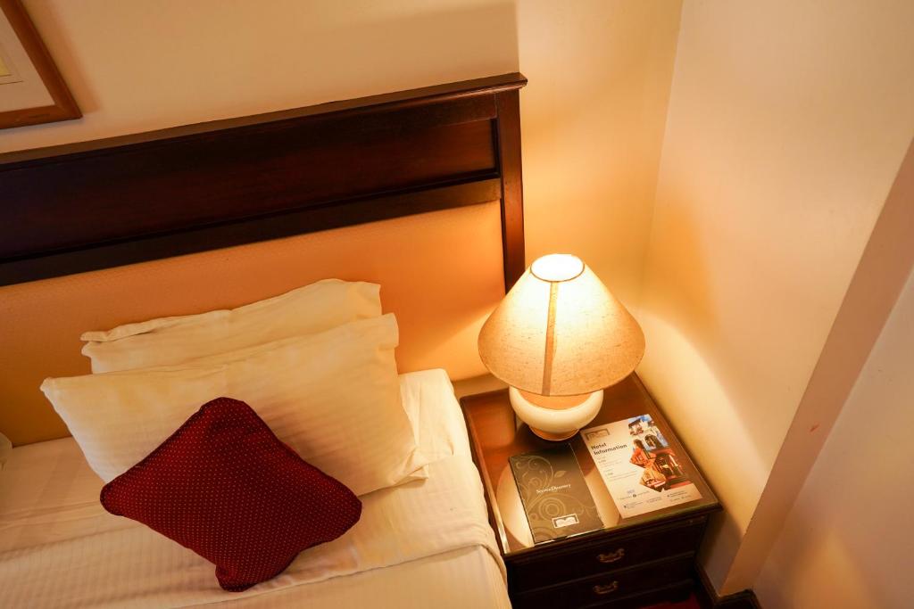 Postel nebo postele na pokoji v ubytování Hotel Arches