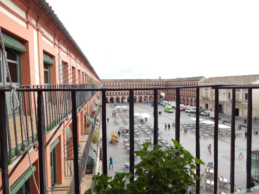 a view of a street from a balcony of a building at Hostel La Corredera in Córdoba