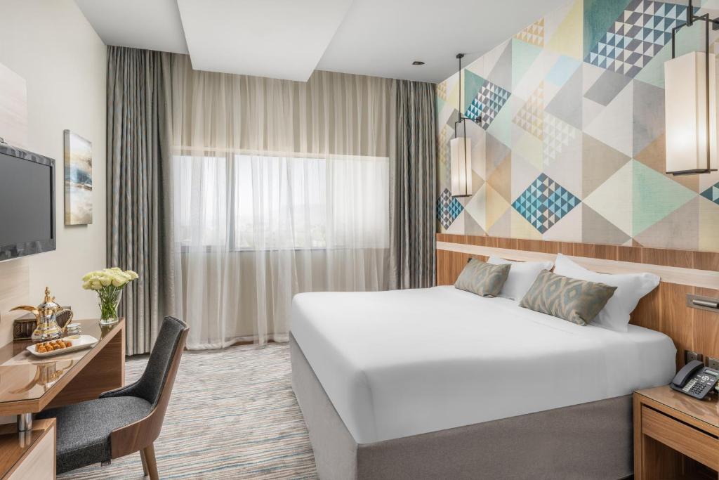 Postel nebo postele na pokoji v ubytování Roots Hotel