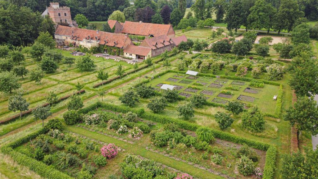 an aerial view of a garden in front of a house at B&B Kasteelhoeve de Kerckhem in Wijer
