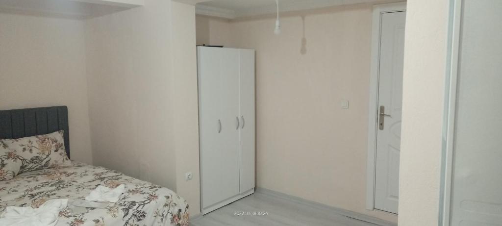 Postel nebo postele na pokoji v ubytování Melekler Pansiyon