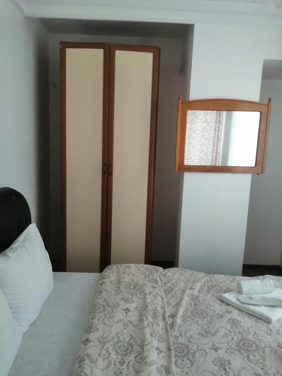 Postel nebo postele na pokoji v ubytování Melekler Pansiyon