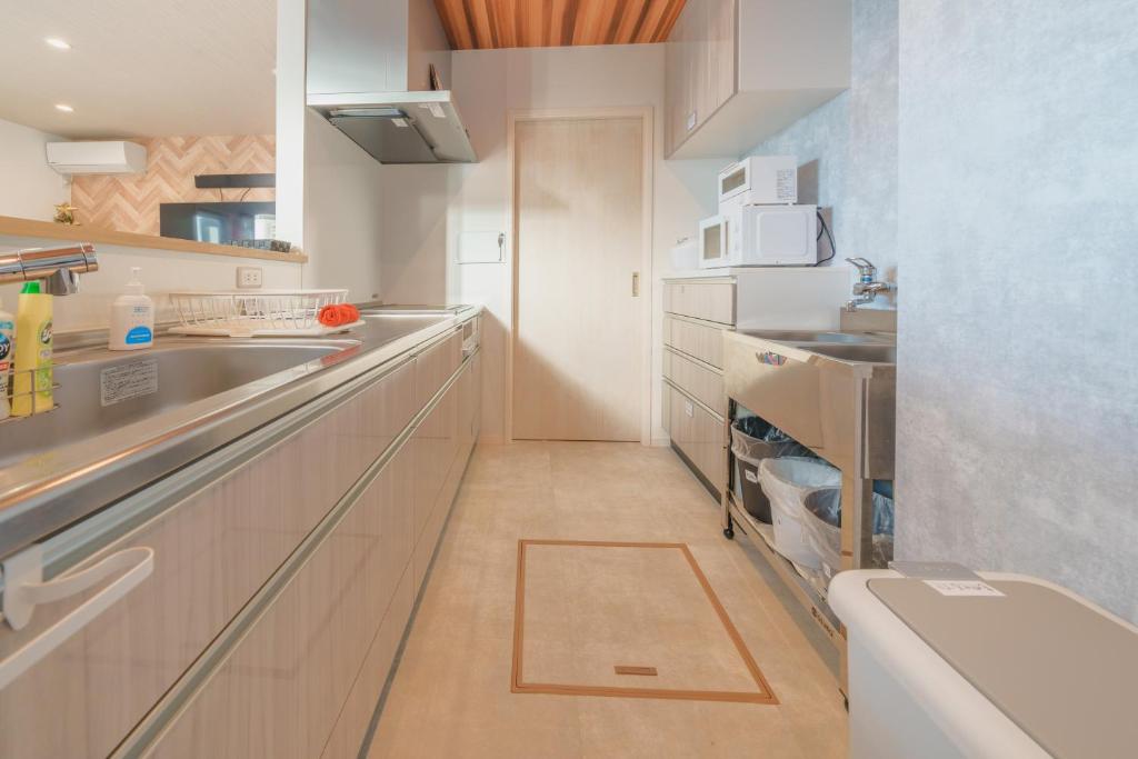 Kuchyň nebo kuchyňský kout v ubytování Ryu shi ma Ocean View Villa