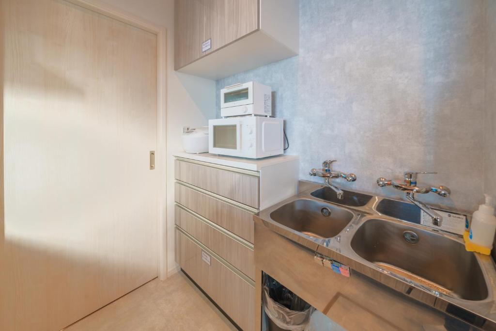 Kuchyň nebo kuchyňský kout v ubytování Ryu shi ma Ocean View Villa