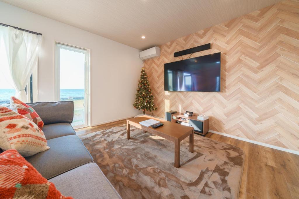 TV a/nebo společenská místnost v ubytování Ryu shi ma Ocean View Villa
