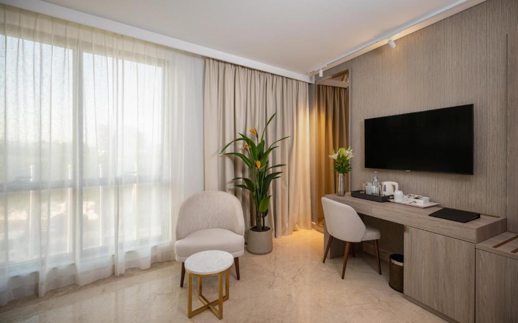Hotel Royal ASBU Tunisにあるテレビまたはエンターテインメントセンター