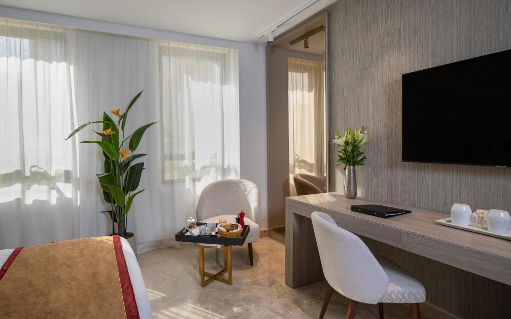 Hotel Royal ASBU Tunisにあるテレビまたはエンターテインメントセンター